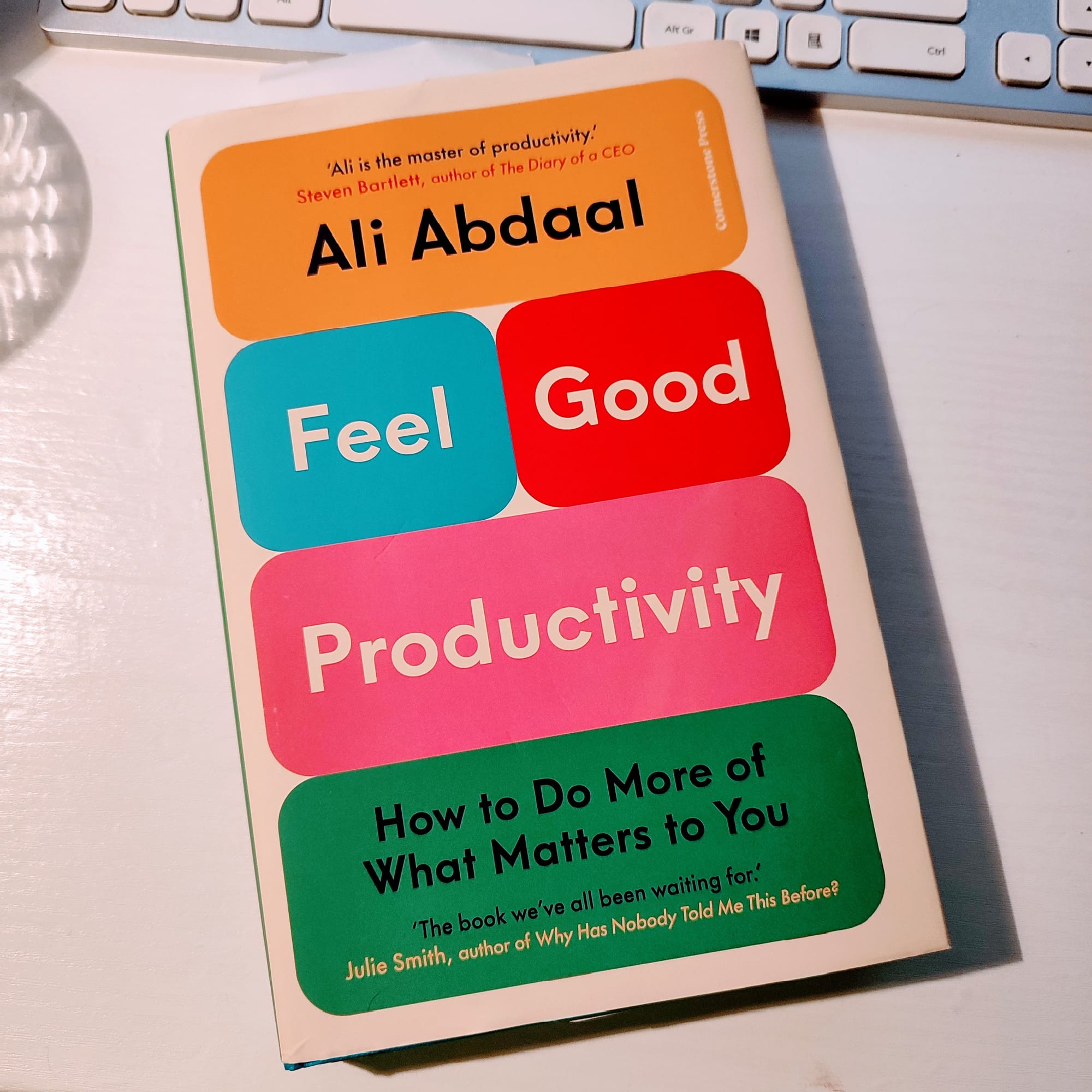 Colourful book cover of Ali Abdaal's book Feel Good Productivity with its Notion style blocks of text and colour.