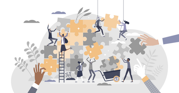 People fitting puzzle pieces together