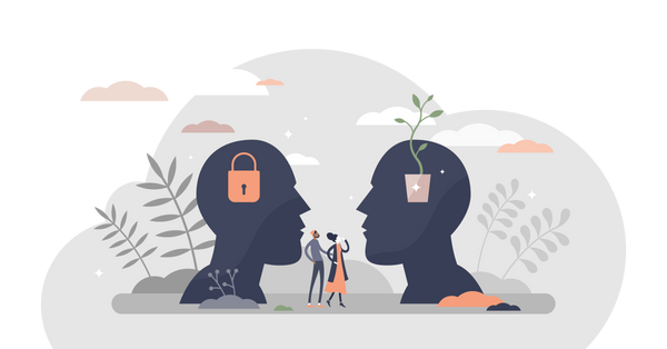 Two people are looking up at two heads, one with a padlock inside and the other with a plant pot. 