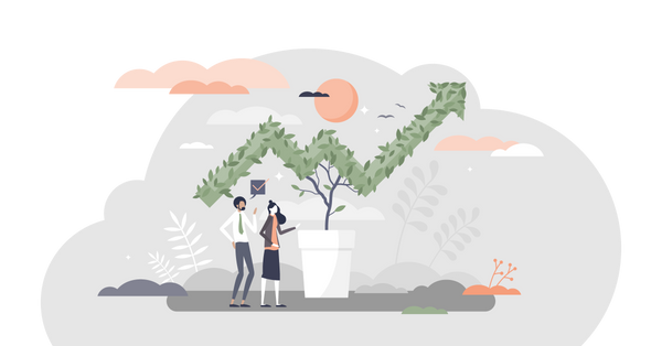 Plant trimmed into the shape of a trend with two people looking on.